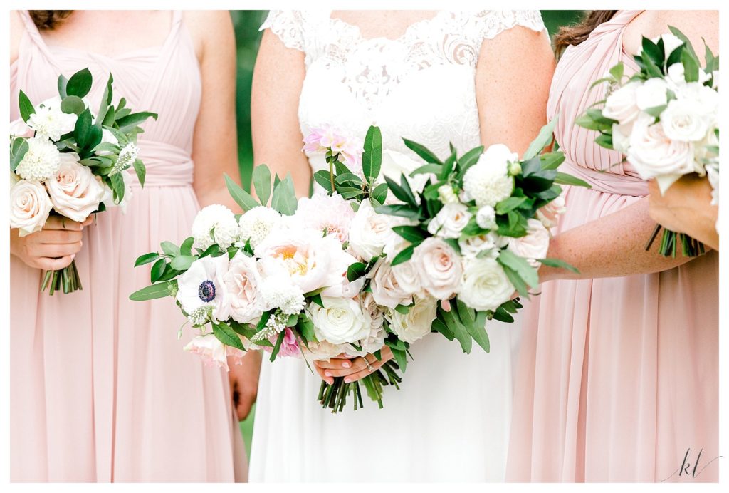 Bridal bouquets with light pink and white flowers by " Flowers by Justine' . Photo by K. Lenox Photography