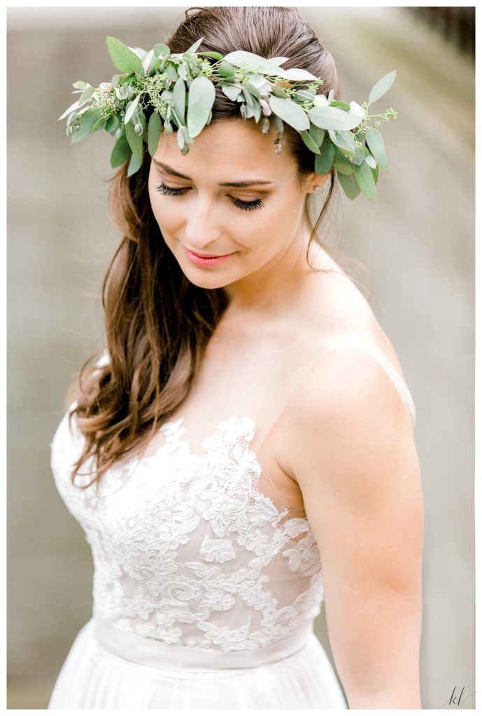 Bohemian inspired greenery crown is worn by a bride on her wedding day. 