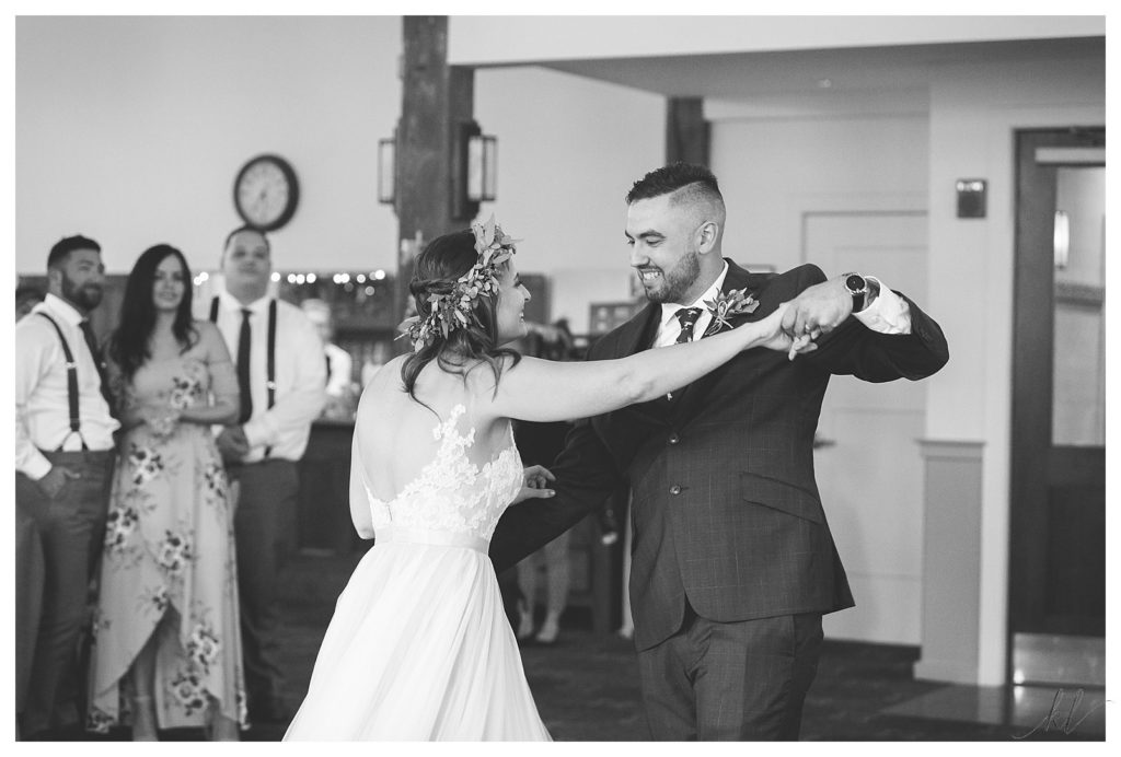 Black and White photo of a bride and groom dancing in the Sugar River Ballroom at the Common Man in Claremont. 