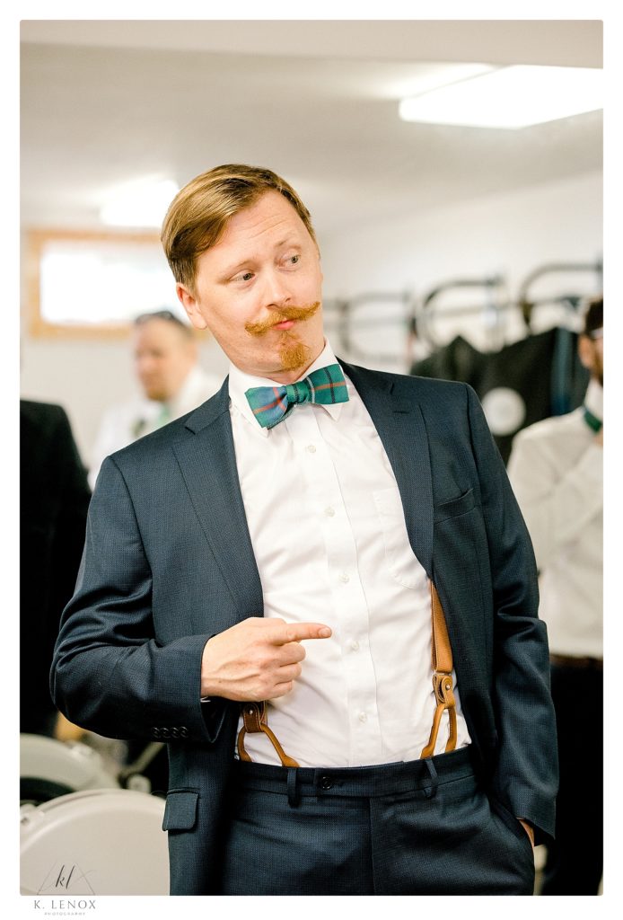 Groom shown with his green and blue plaid bow-tie 
