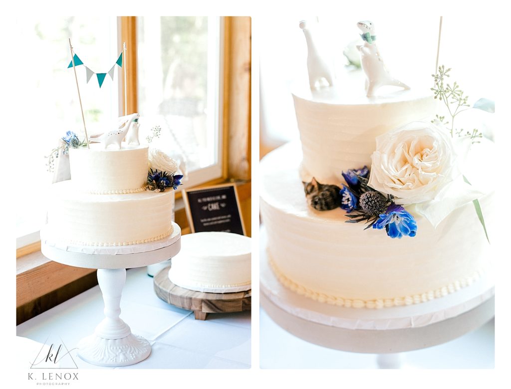 Simple White two tiered Wedding cake with white dinosaur cake toppers