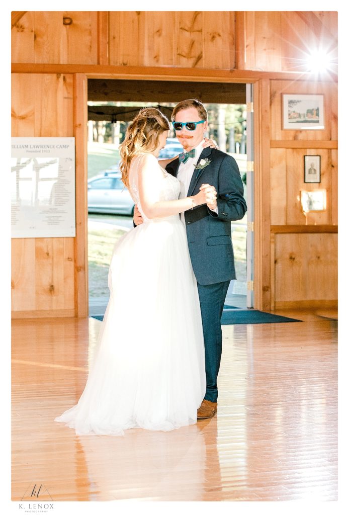 Light and Airy photo of a bride and groom's first dance during their camp wedding reception. 