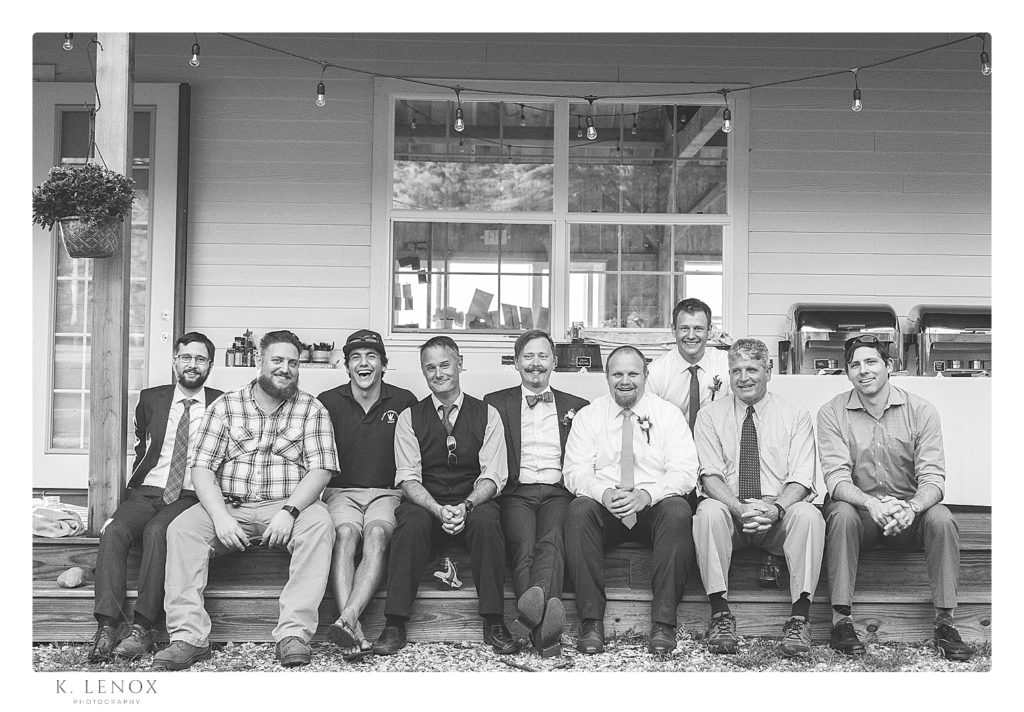Group photo of William Lawrence Camp alumni on the porch of the centennial lodge. 