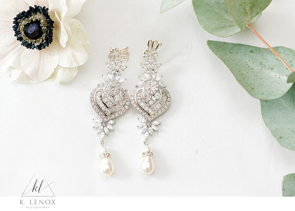 White Gold and Diamond earrings with a dangly pearl. 