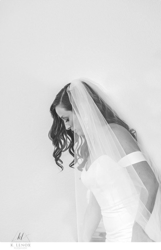 Black and White Candid photo of a bride on her wedding day. 