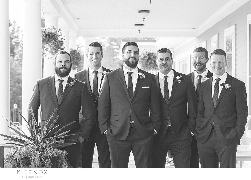 Black and White photo of a groom and his groomsmen on the porch of The Mountain View Grand. 