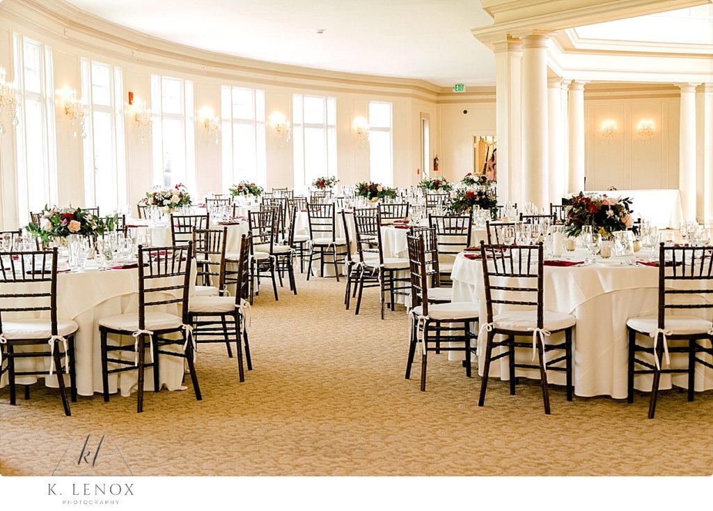 Reception picture in the Crystal Ballroom at the Mountain View Grand showing the tables with floral centerpieces. 
