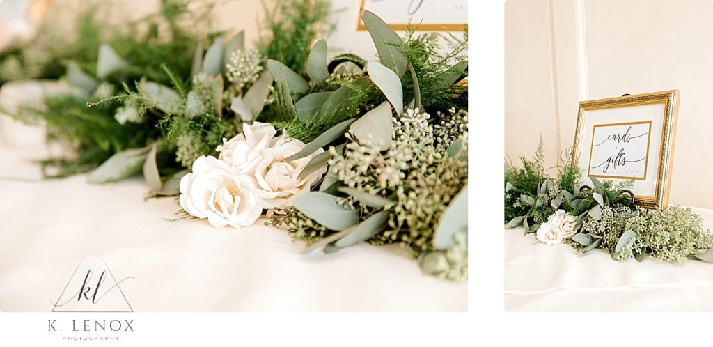 White flowers and greenery line the gift table at a wedding reception at the Mountain View Grand. 