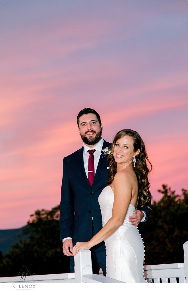Sunset photo of a bride and groom at the Mountain view Grand- showing pink and purple sky