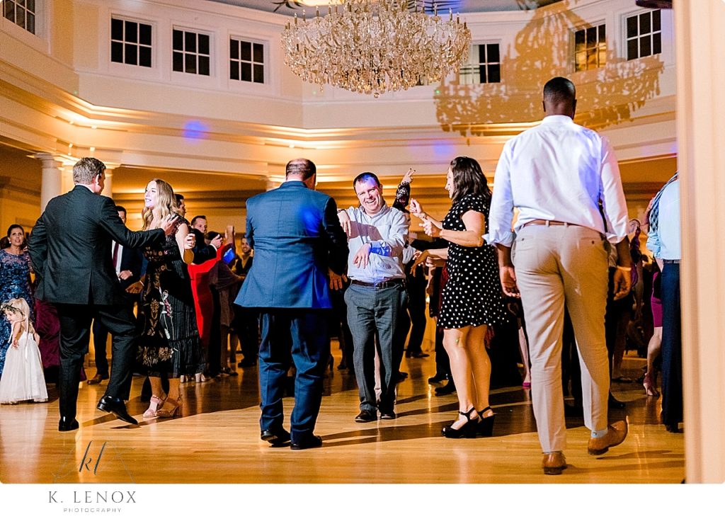 Guests dancing during a fall wedding reception at the Mountain View Grand in Whitefield NH. 