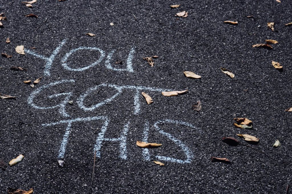 Picture of Asphalt with chalk writing that says "You Got this"