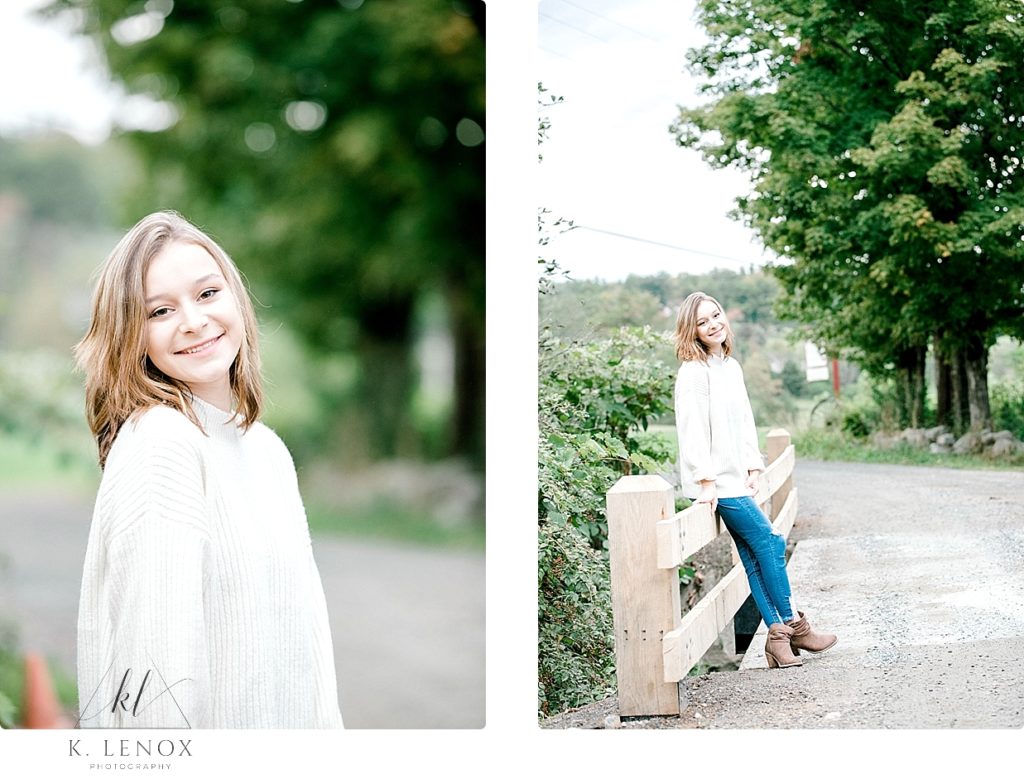 Light and Airy senior photos taken at Stonewall Farm- Girl wearing bluejeans and a white sweater. 