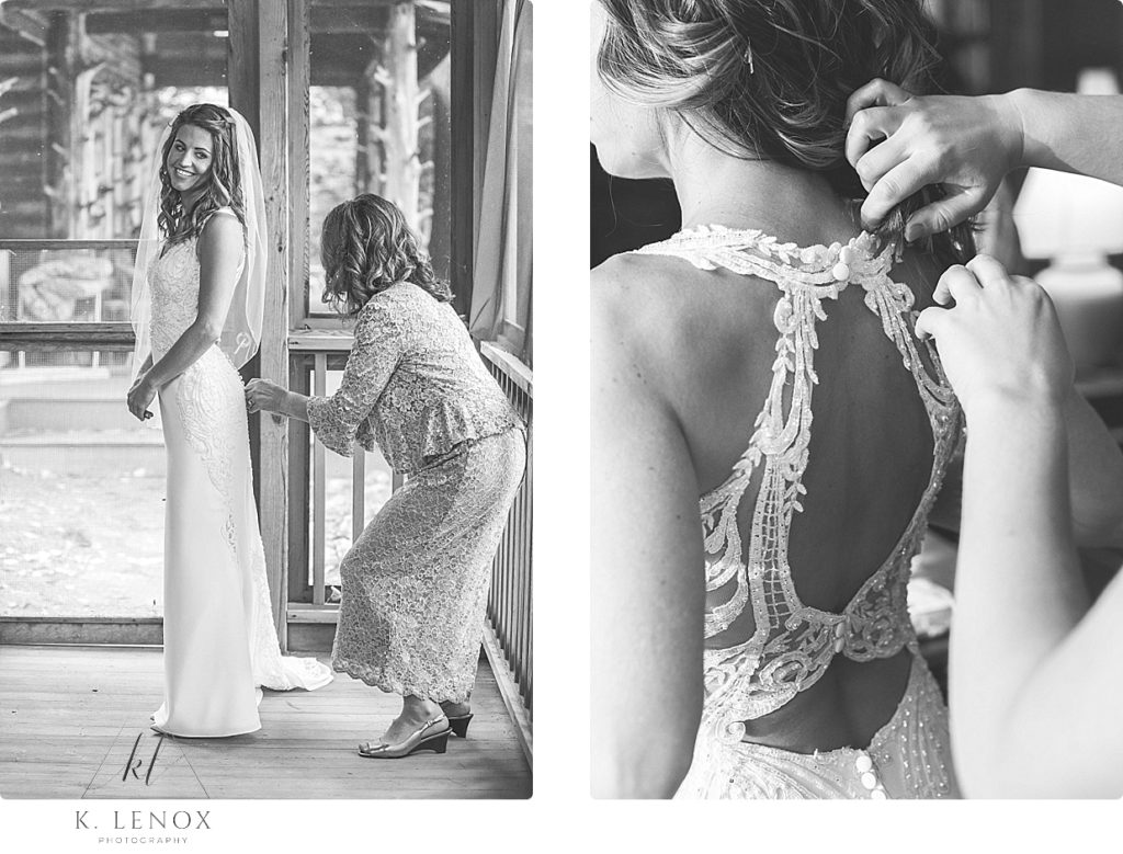 Black and White photo of a mom helping her daughter into the wedding dress for a wedding at Camp Takodah in NH. 