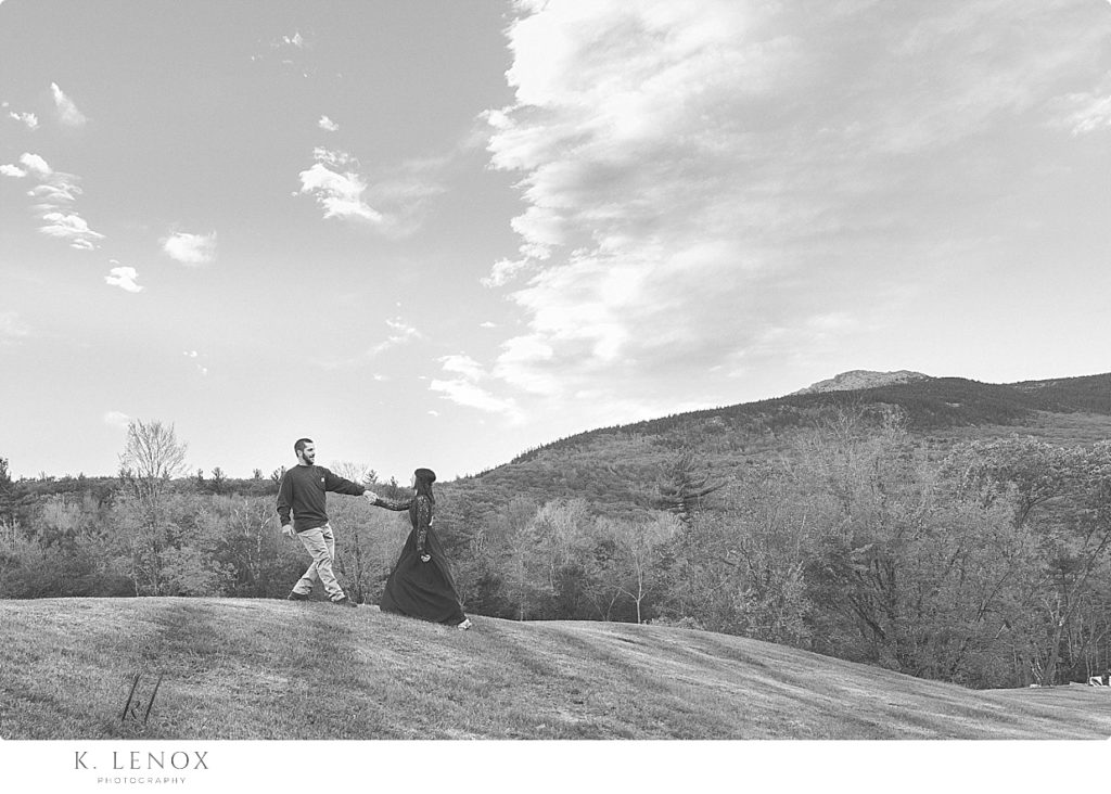 Engagement Session at the Grand View Estate showing a black and white photo of a man and woman on the hill. 