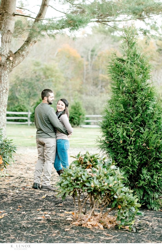 Fall Engagement Session at the Grand view Estate in Jaffrey showing a man and woman casually hugging. 