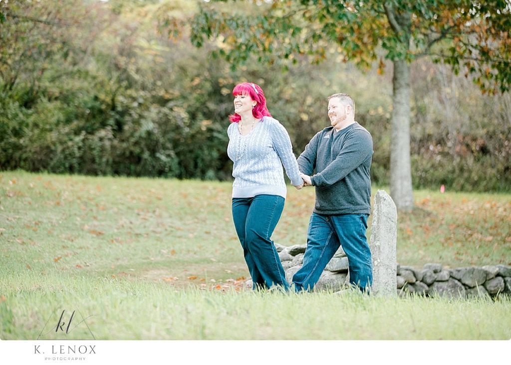 Woman with Pink hair walks with her boyfriend at the Path of life garden. 