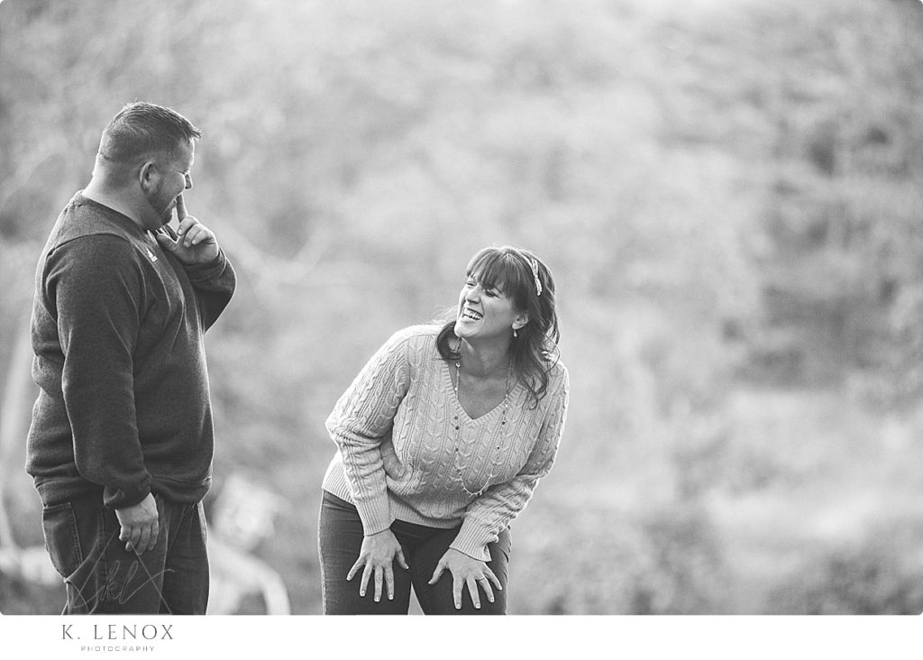 Candid and Natural black and white photo of a couple laughing at the Path of Life Garden in Vt. 