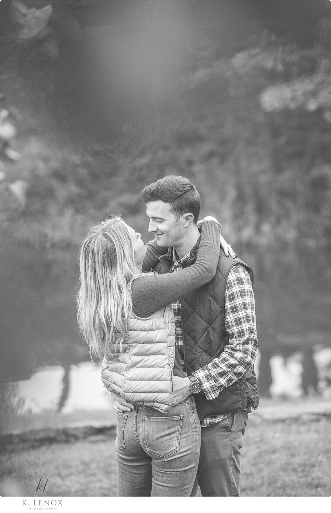 Black and White photo of an engaged couple while at Scott Farm in Brattleboro during their photo session with K. Lenox
