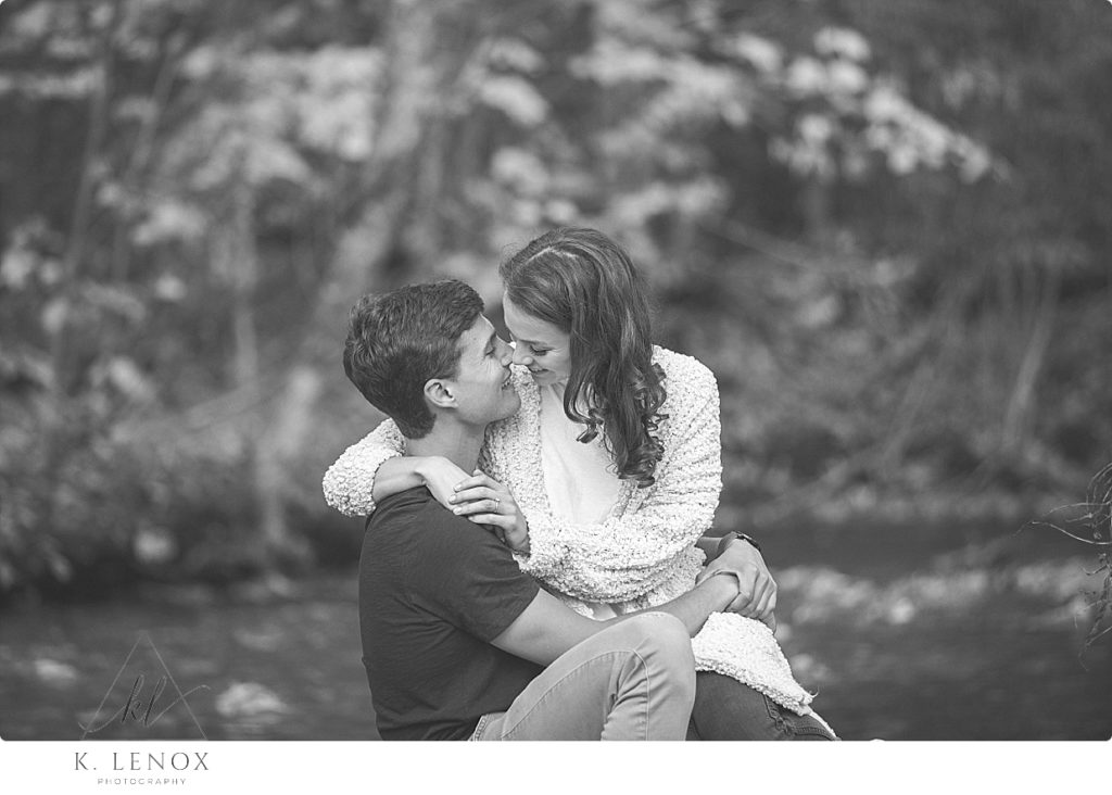 Man and Woman cuddle and Kiss- Black and White photo. 