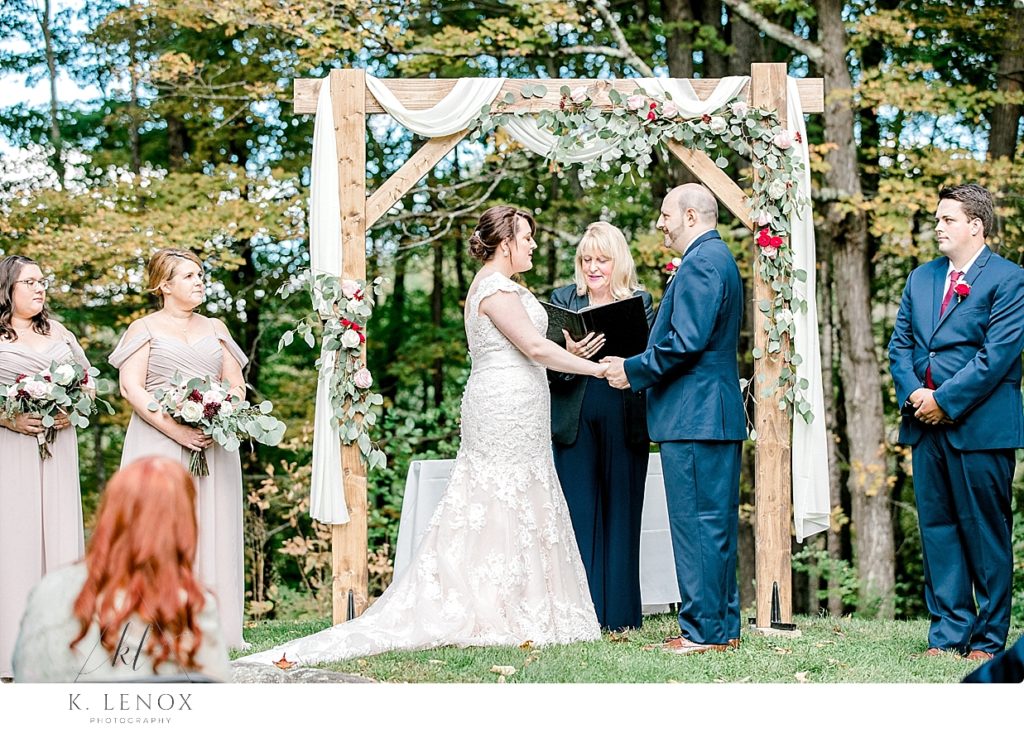 Image of a wedding ceremony at the knoll at Stonewall Farm. 