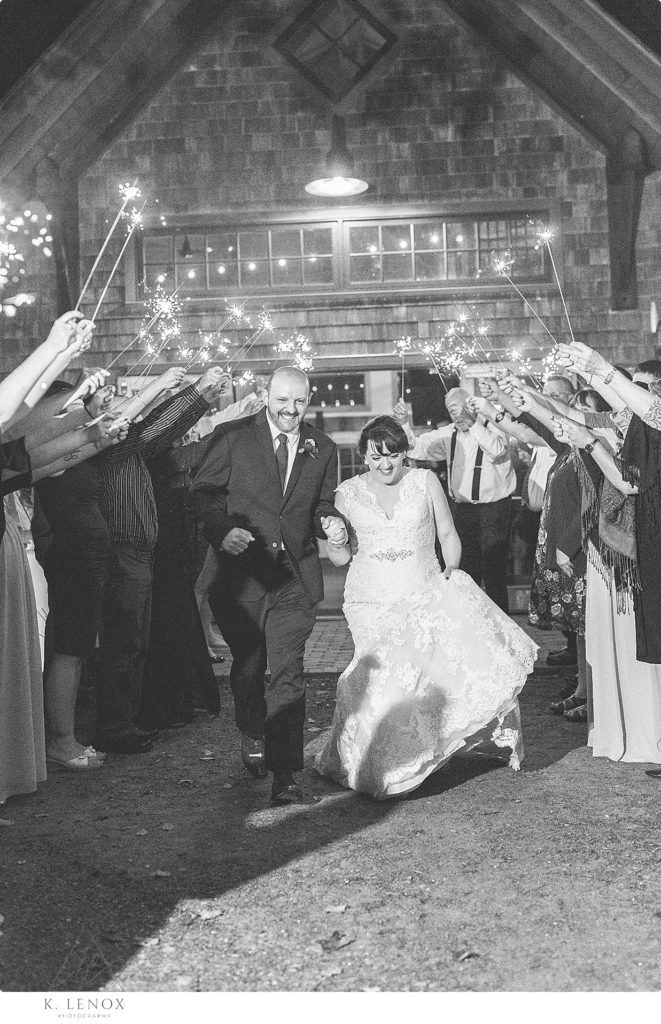 Black and white photo of a bride and groom's sparkler send off at Stonewall Farm. 