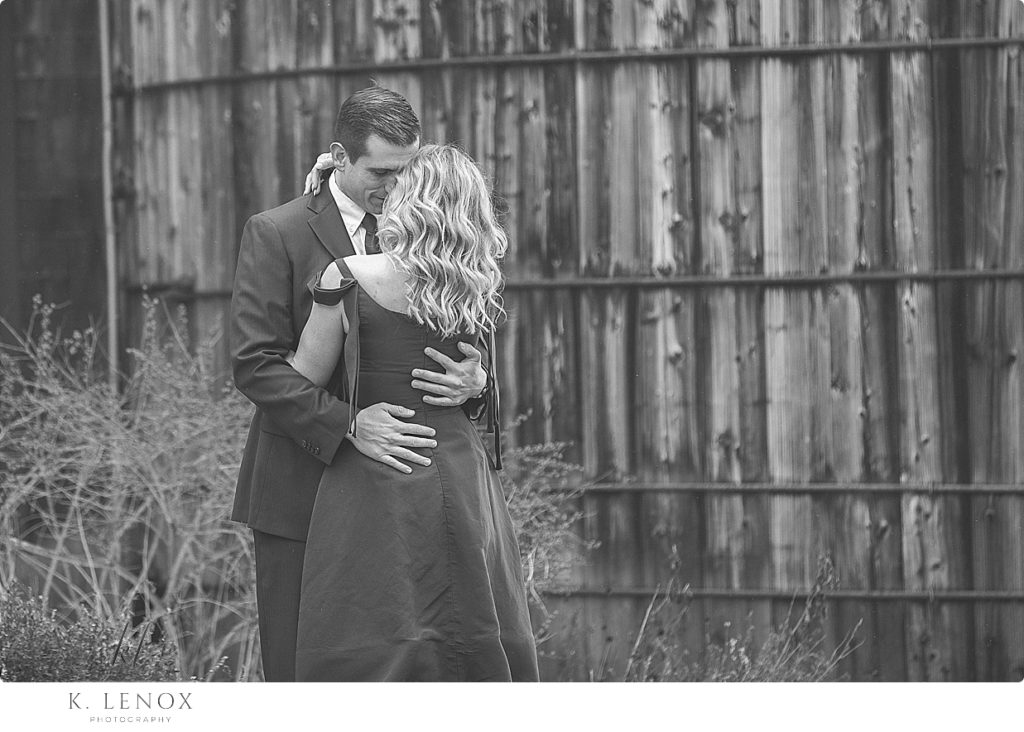 Black and White photo of a man and woman sharing a special moment during their light and airy engagement session at Stonewall Farm. 