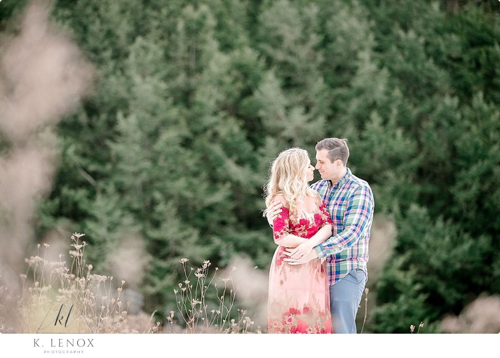 Light & Airy Winter Engagement Session at Stonewall Farm- with Evergreens in the background. 