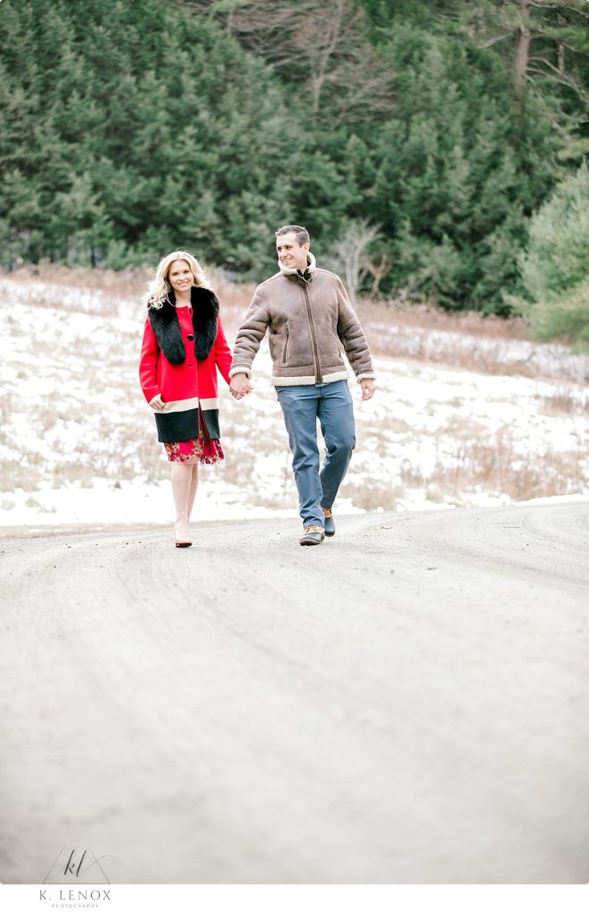 Light & Airy Winter Engagement Session at Stonewall Farm- Girl wearing red jacket with Black fur lapel