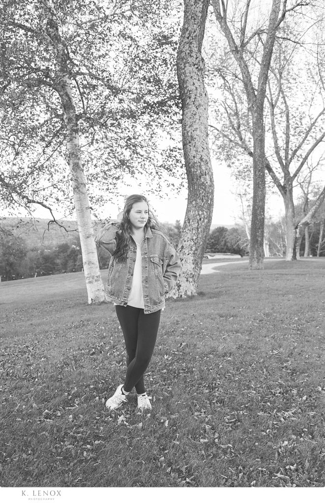 Black and White Chesterfield Senior Photo showing a girl wearing a vintage Levi's Jean Jacket standing between trees
