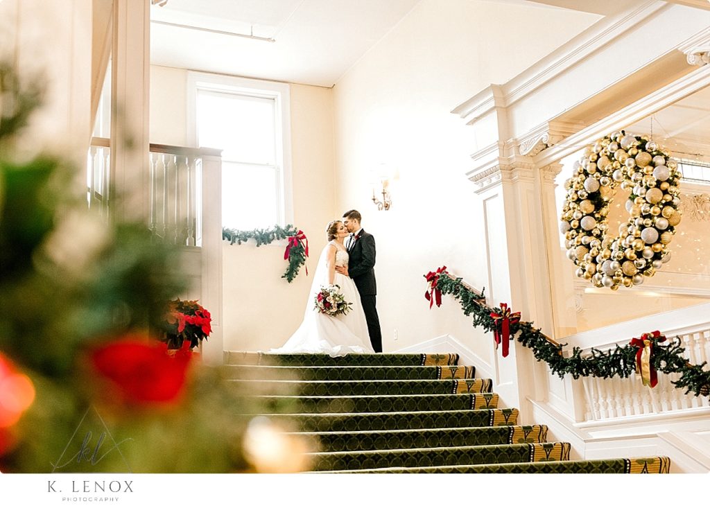 Bride and Groom on the Main Staircase at the Omni Mount Washington Resort in Bretton Woods NH. 