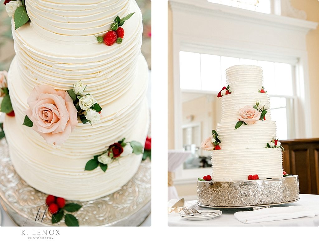 Simple 4 tiered white wedding cake with minimal berries and flowers. 