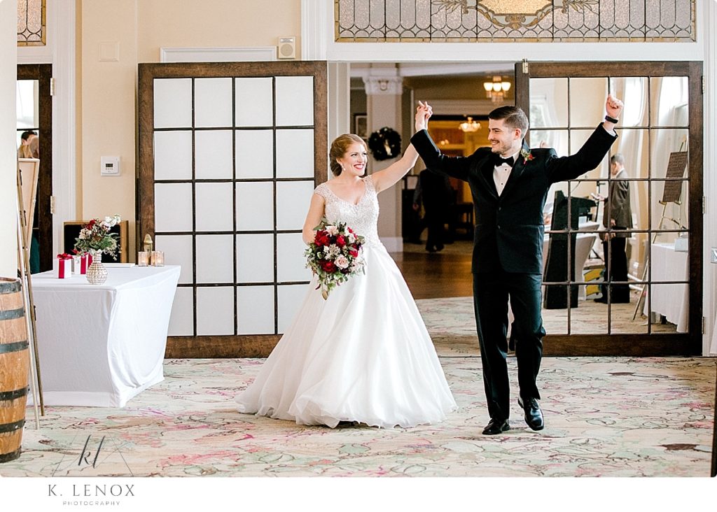 Bride and Groom get introduced as Mr. and Mrs. for their Christmas Wedding Reception in the Sun Dining Room at the Omni Mount Washington Resort. 