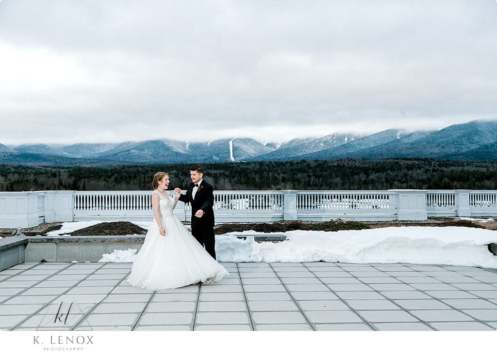 Winter Wedding at the Omni Mount Washington Resort- photo of a bride and groom on the Jewel Terrace at Dusk. 
