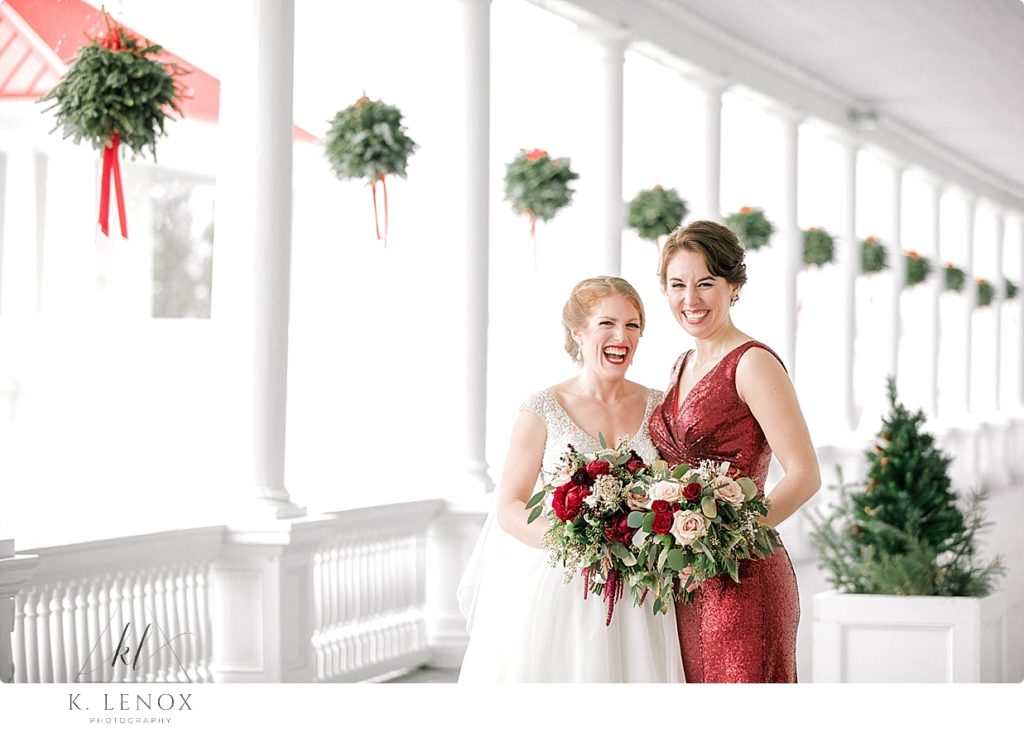 Bride laughs with her Matron of Honor. Bridesmaid is wearing a red sequin Dress 