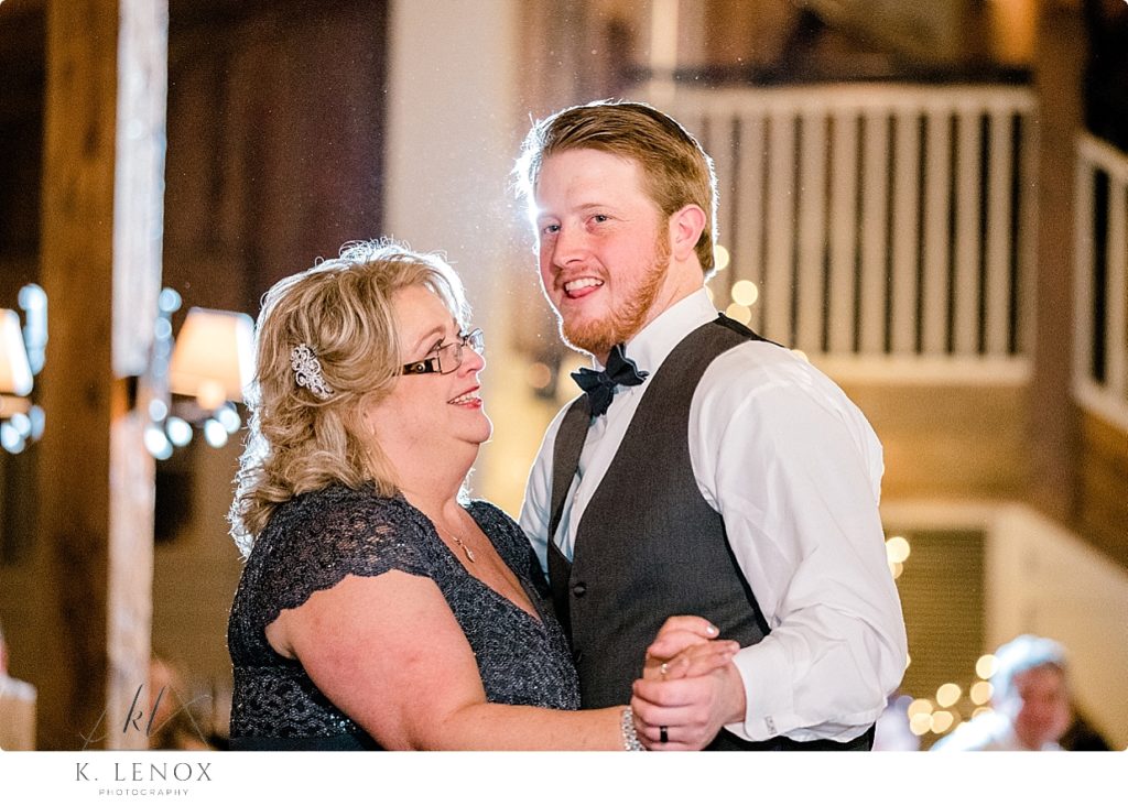 Mother and son dance at the barn at Gibbet hill' winter wedding. 