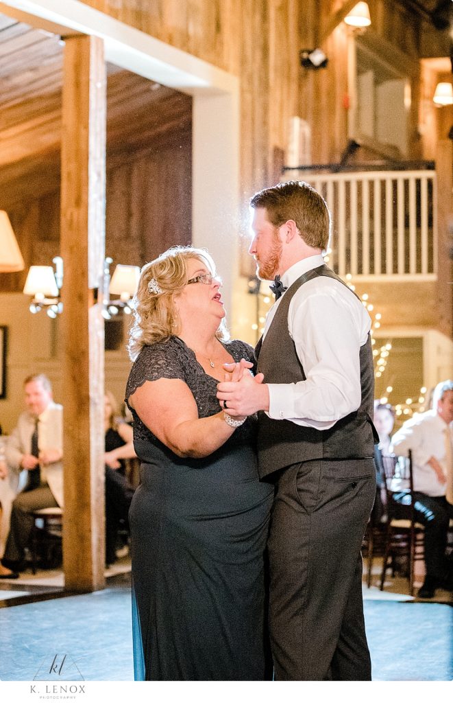 Mom and Groom share the parent dance at a winter wedding at the Barn at Gibbet Hill. 