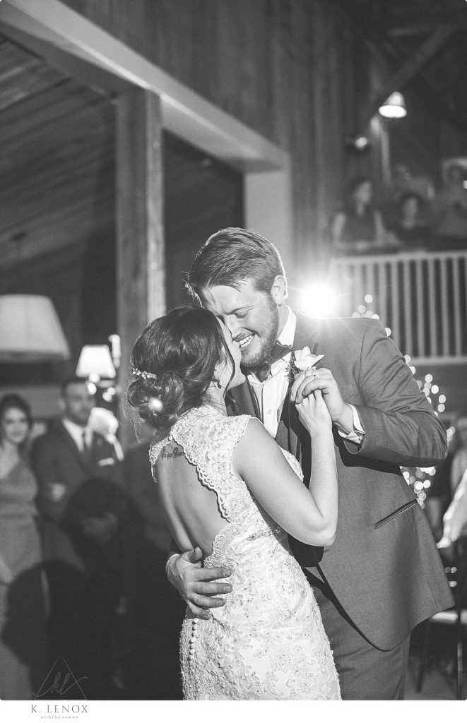 Black and White photo of a Bride and Groom's first dance at their Winter Wedding at the Barn at Gibbet Hill. K. Lenox Photography