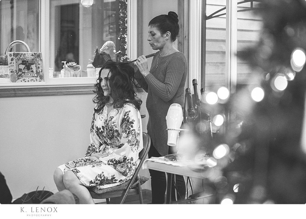 Black and White photo of a bride getting ready for her winter wedding at the Barn at Gibbet Hill in Groton Ma. 