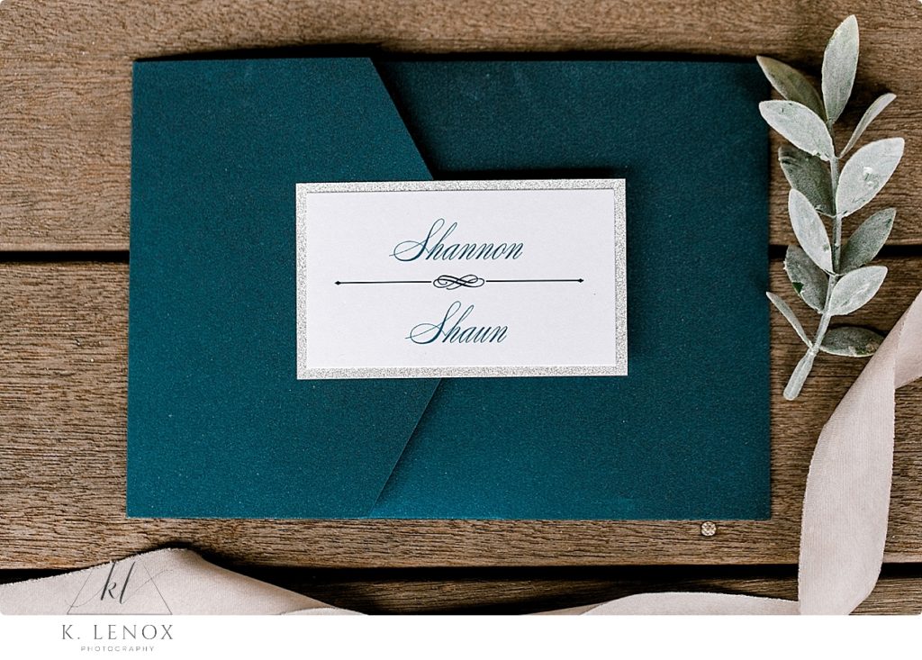 Blue Wedding invitation with white and blue font. 