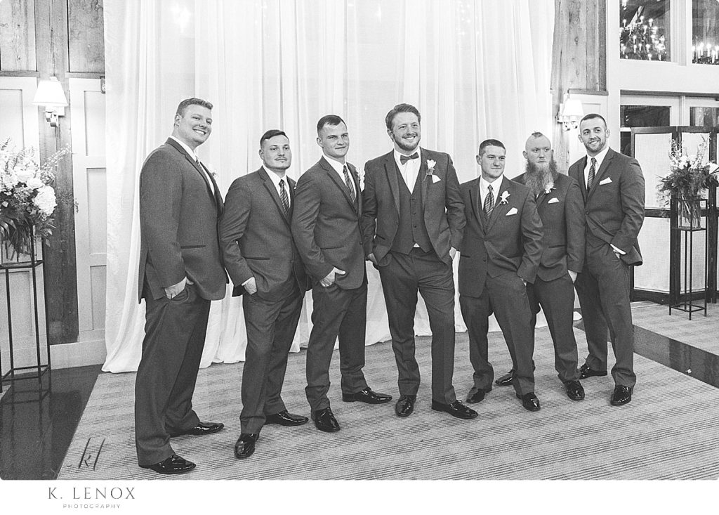Black and White portrait of a groom with his groomsmen. 