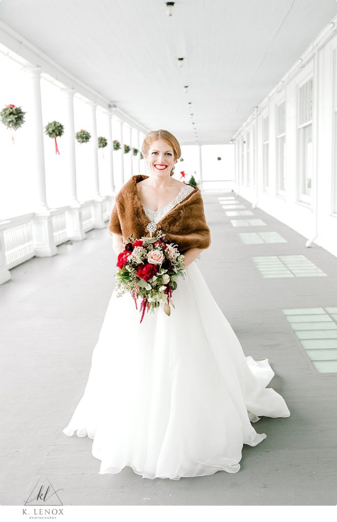 Bride wearing a brown shawl for her wedding at the omni mount washington resort