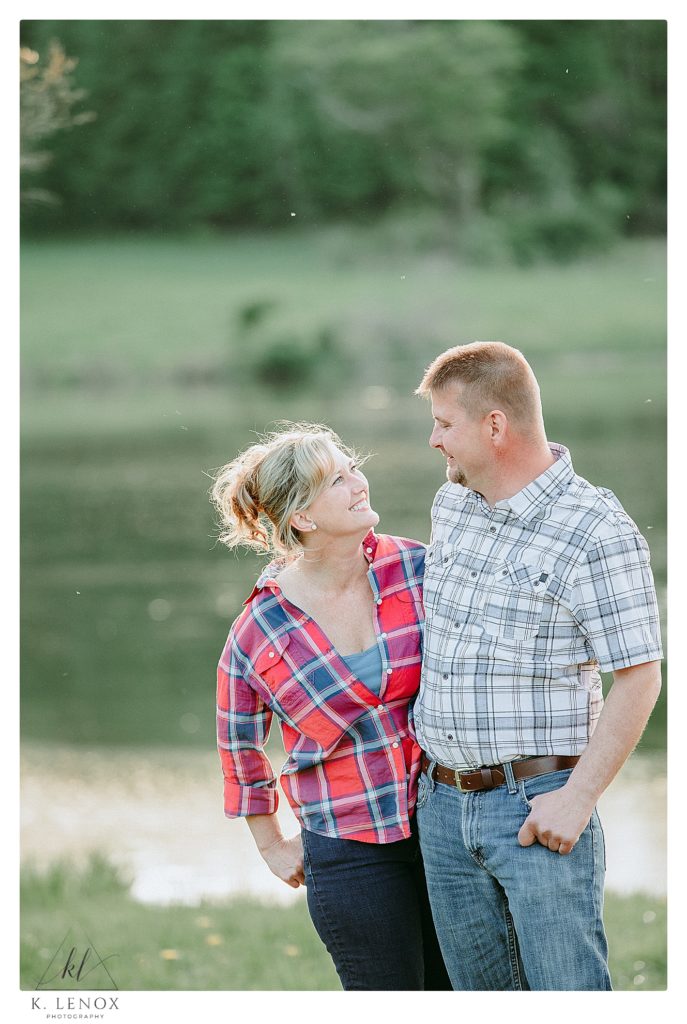 Light and airy photo of a couple wearing plaid shirts for their engagement session in Honesdale PA