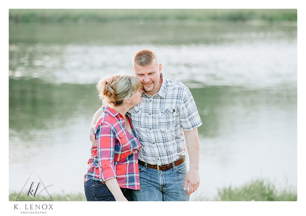 Candid, light and airy engagement photo of a man and woman laughing and talking. 