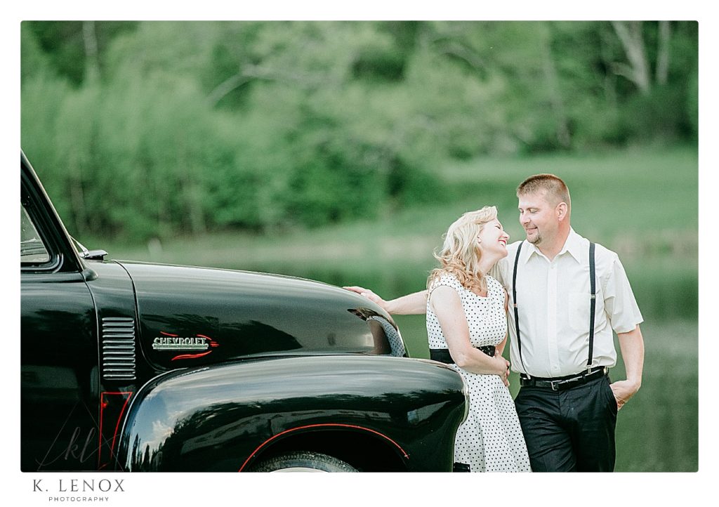 Candid moment caught during an engagement session with a 1952 Black Chevy Truck. 