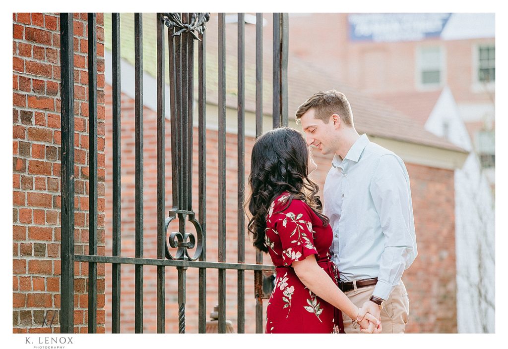 Engagement Session in Peterborough-  Man and Woman photographed in front of an iron gate