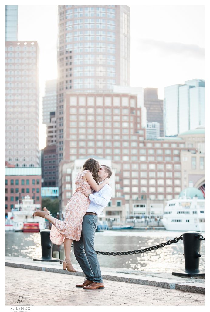 Candid, Light and Airy Photo taken of a man and woman near the Seaport in Boston during their spring engagement session with K. Lenox photography