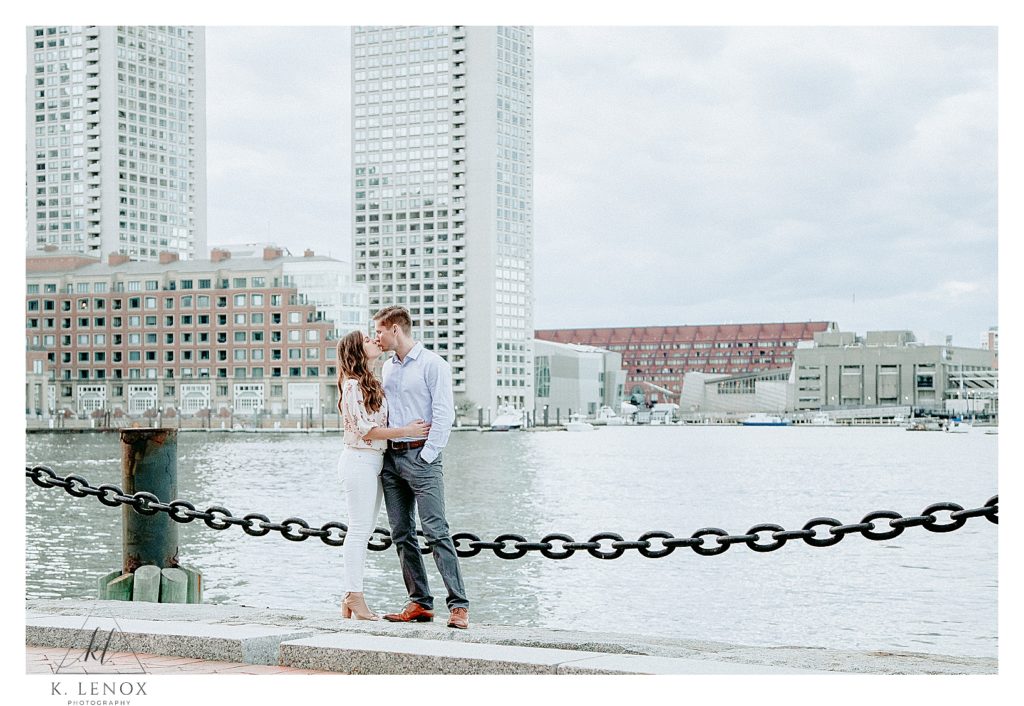 Man and Woman hug and talk while engagement photographer- K. Lenox Photography captures this image. 