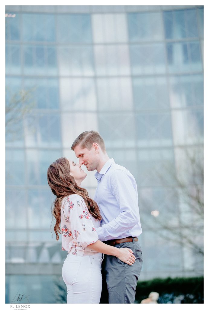 Man and Woman interact naturally during their engagement session in Boston. 