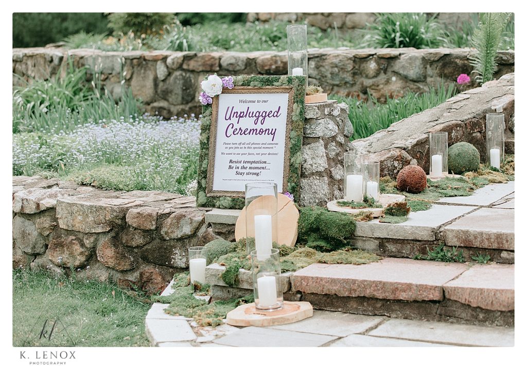 Enchanted Forest Wedding with a Game of Thrones Twist- Unplugged ceremony sign on the stone terrace at the Shuttuck Golf Course. 