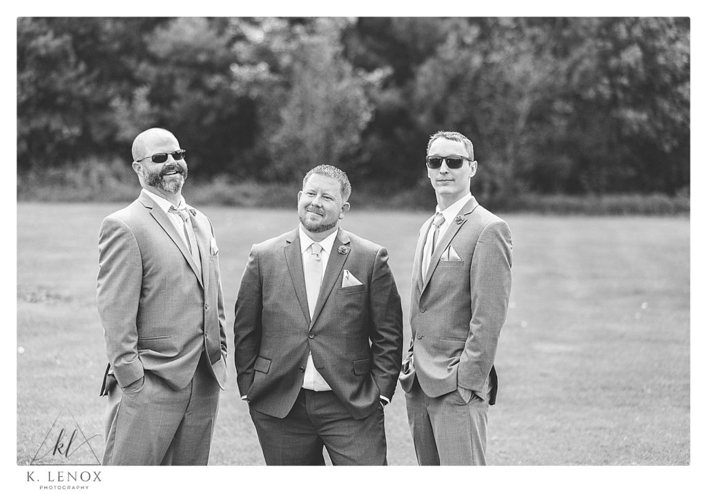 Black and White photo of a Bride with his two groomsmen. 